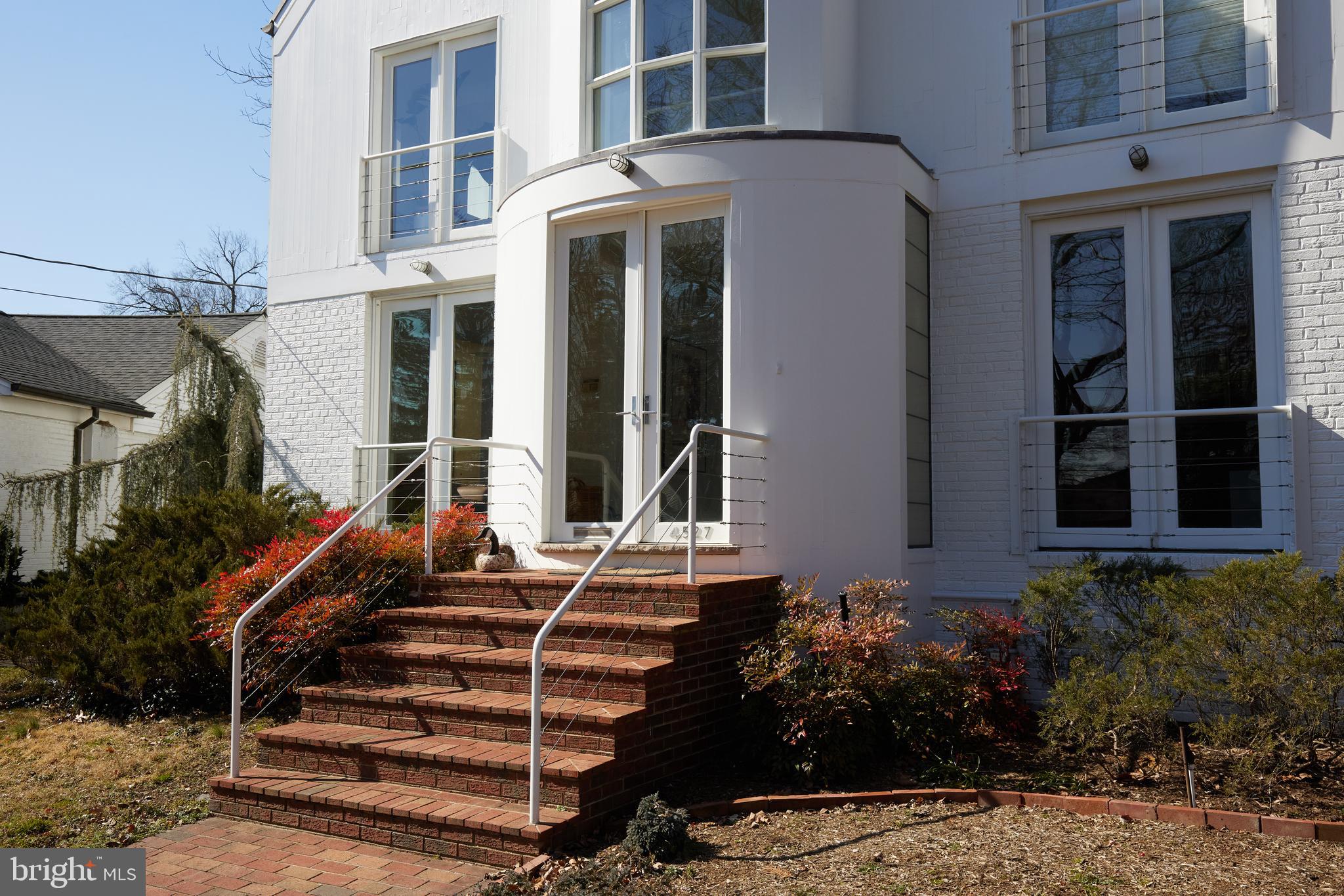 4527 Q Place Northwest Washington, DC 20007 - Photo 4 of 59 a front view of a house with a yard