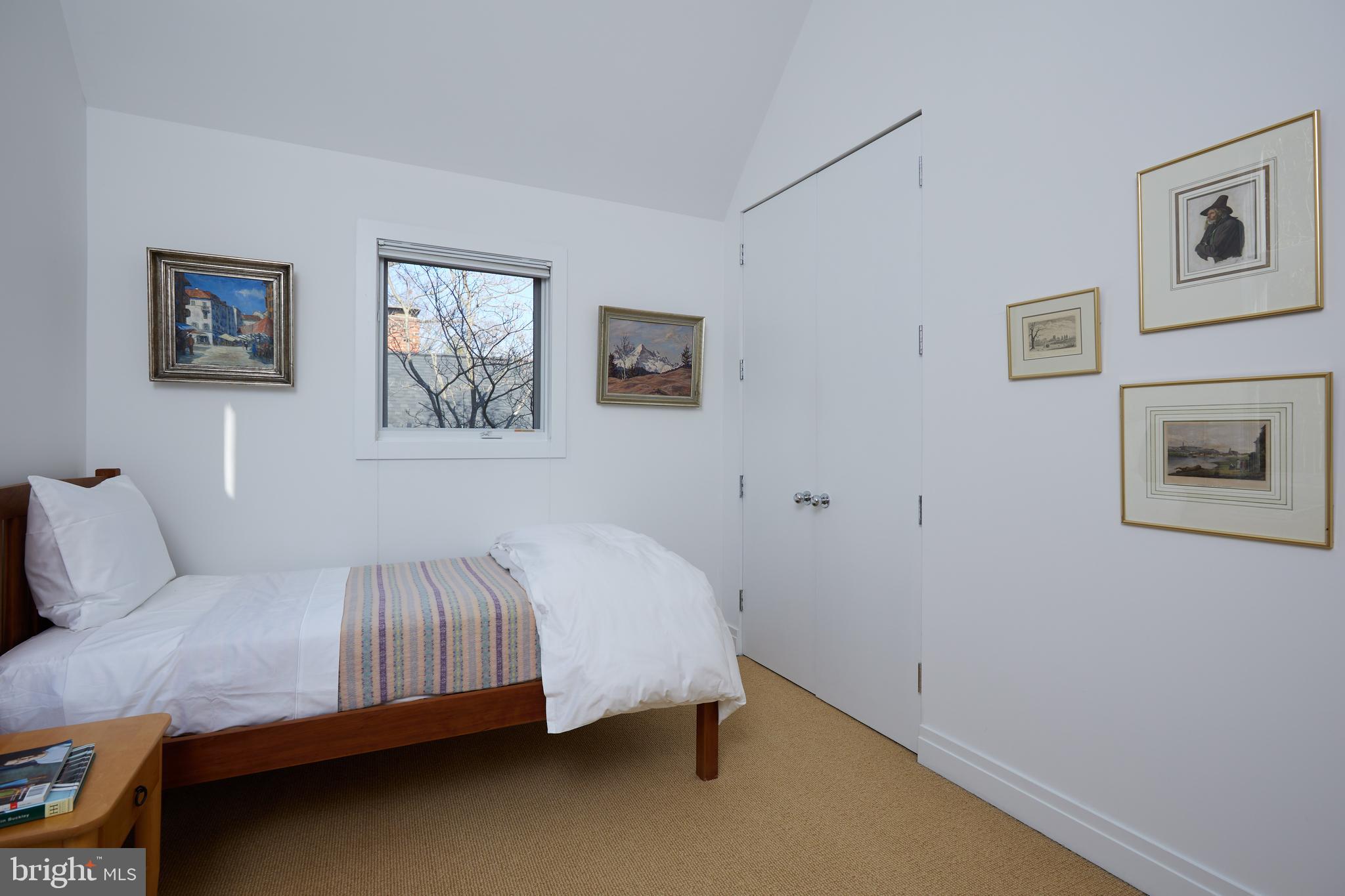 4527 Q Place Northwest Washington, DC 20007 - Photo 47 of 59 a bedroom with a bed and wall painting