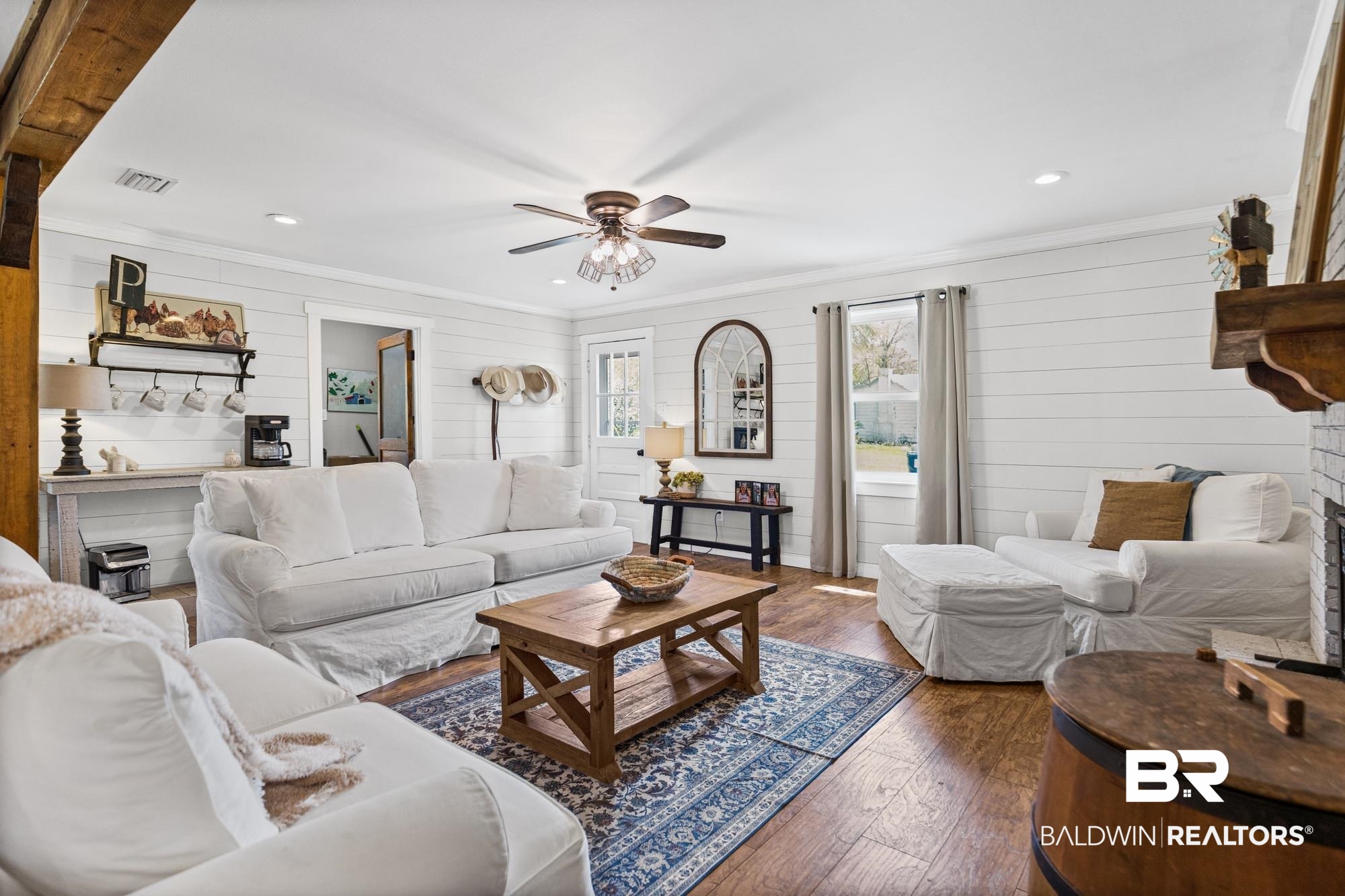 11100 Rhett McConnell Road Theodore, AL 36582 - Photo 6 of 47 Living area with ceiling fan, wood-type flooring, wooden walls, recessed lighting, and crown molding