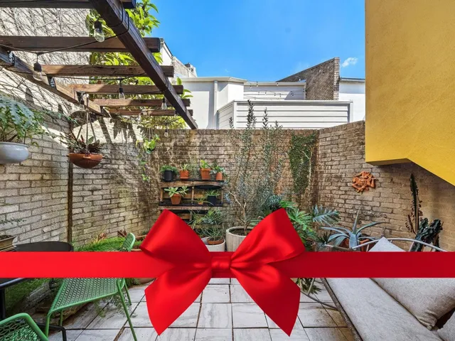 a view of balcony with two chairs and a table