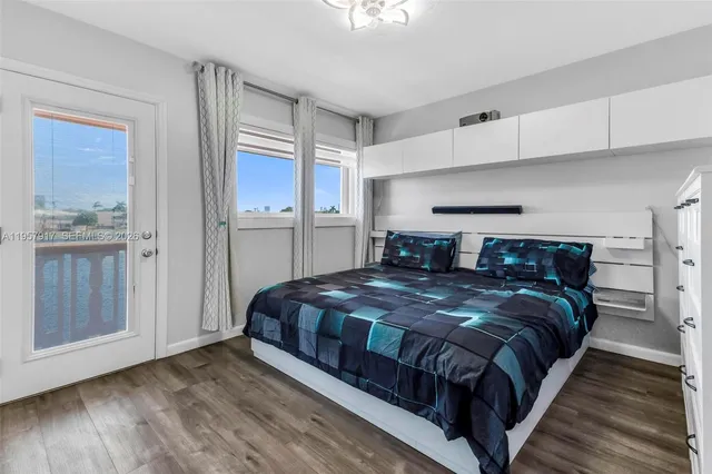 a bedroom with a bed and cabinet