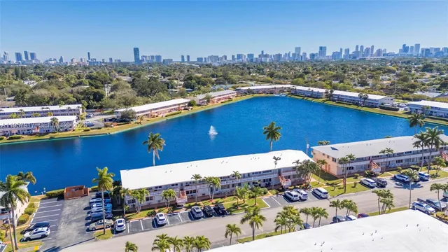 an aerial view of a house with a swimming pool