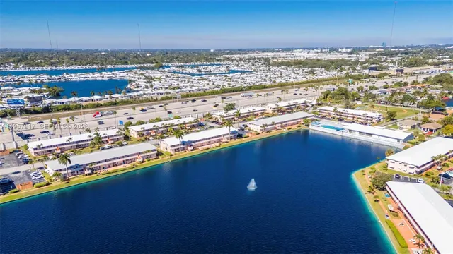 a view of a swimming pool with outdoor seating and yard