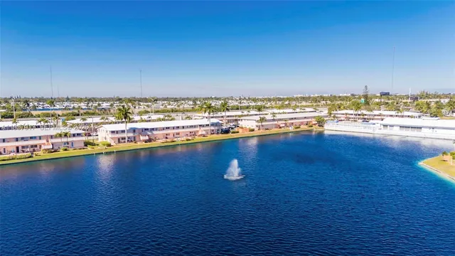 a swimming pool with outdoor seating and yard