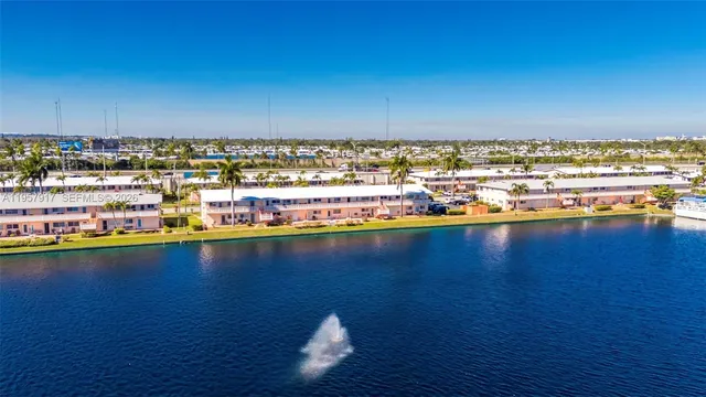 a view of swimming pool with outdoor seating and a yard