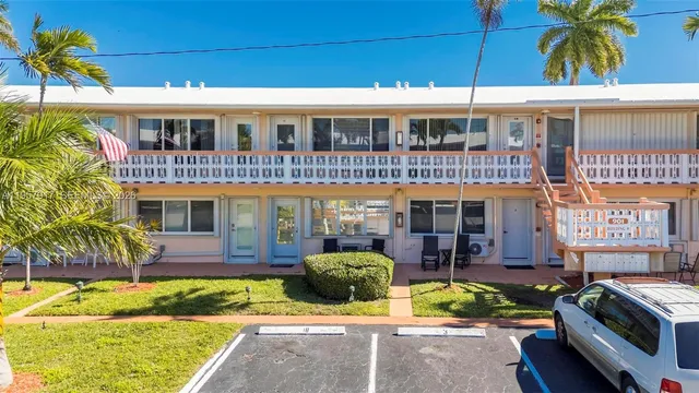 a view of two chairs in the balcony