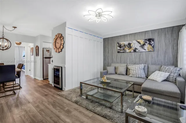 a living room with furniture a fireplace and a window