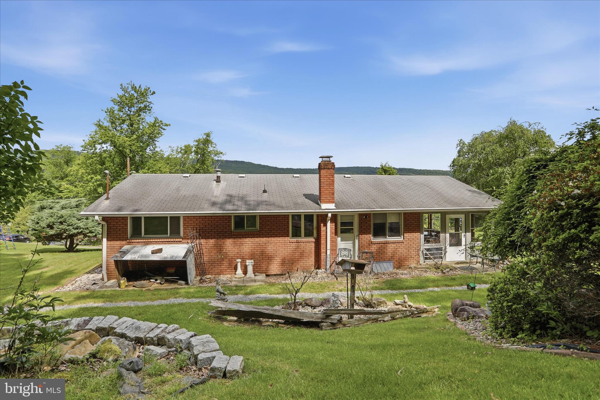 199 Buser Street Ridgeley, WV 26753 - Photo 34 of 49 a front view of a house with a garden