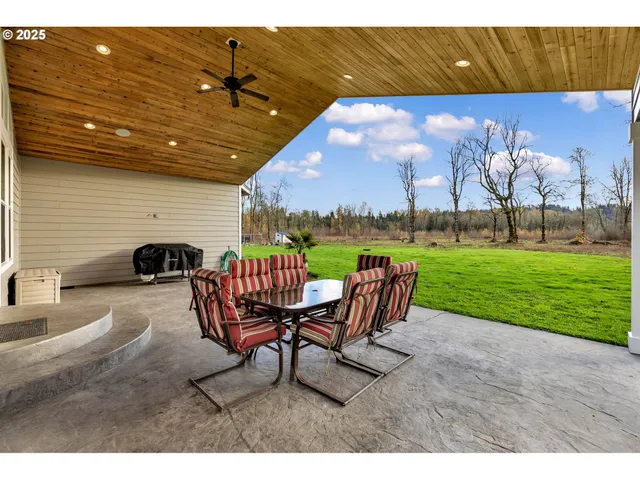 a view of a chairs in backyard