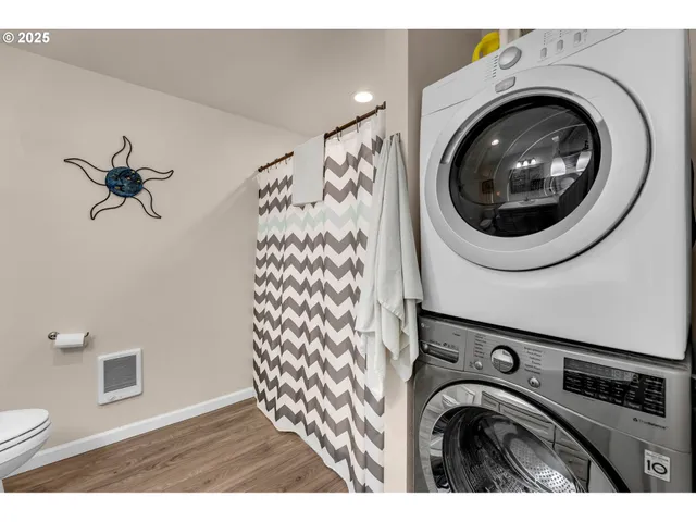a view of a hallway with washer and dryer