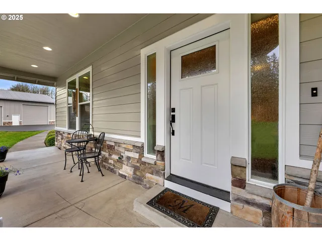 a patio with table and chairs