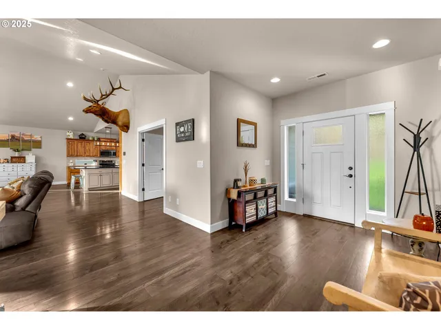 a view of a livingroom with furniture and wooden floor