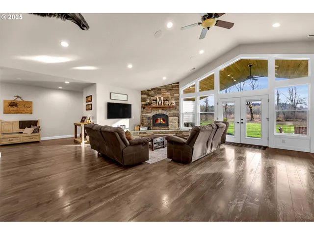 a living room with fireplace furniture and a flat screen tv