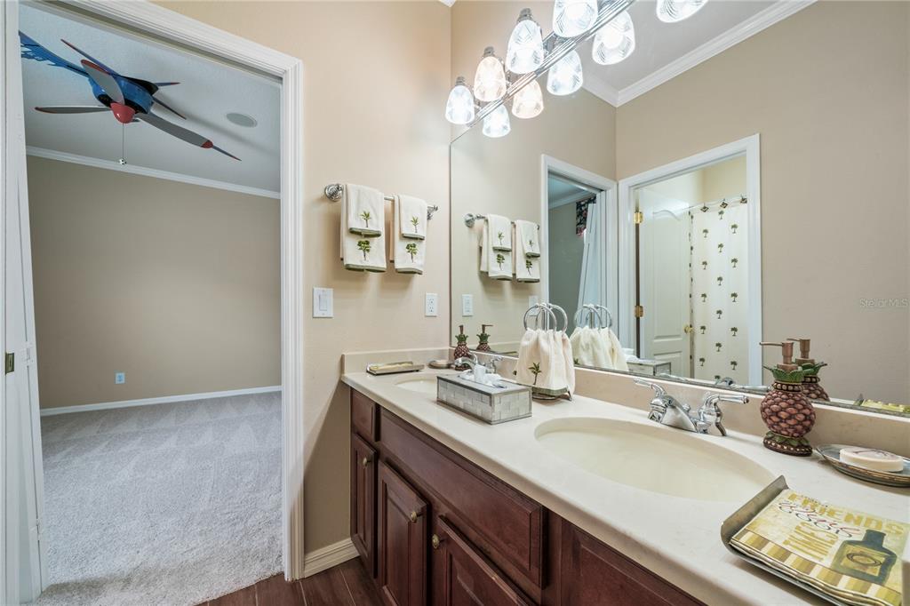 11610 Grove Arcade Drive Riverview, FL 33569 - Photo 18 of 35 a bathroom with a sink a double vanity and a mirror