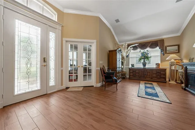 a living room with furniture fireplace and flat screen tv