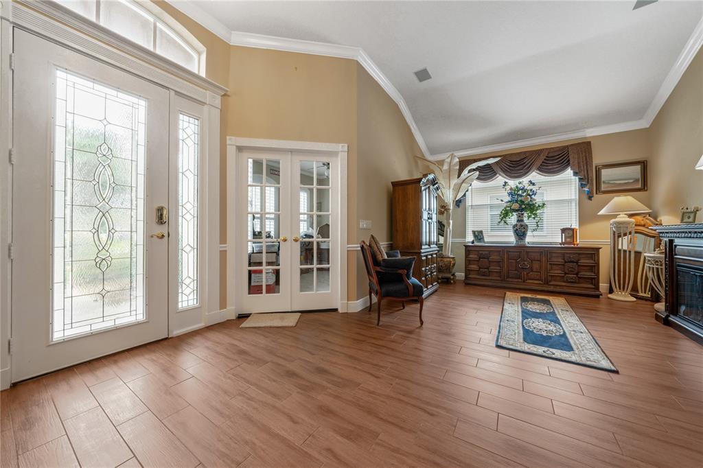 11610 Grove Arcade Drive Riverview, FL 33569 - Photo 4 of 35 a living room with furniture and a wooden floor