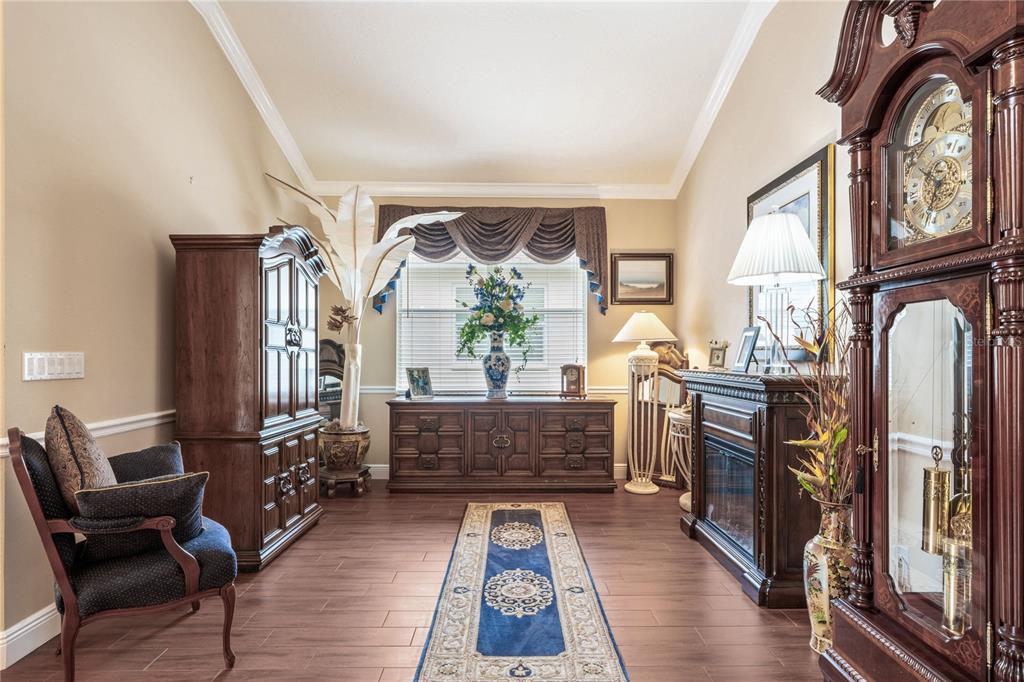 11610 Grove Arcade Drive Riverview, FL 33569 - Photo 6 of 35 a living room with furniture fireplace and flat screen tv