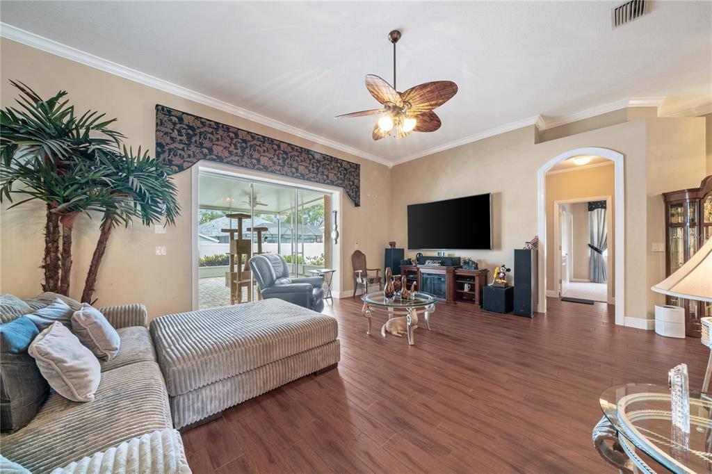 11610 Grove Arcade Drive Riverview, FL 33569 - Photo 7 of 35 a living room with furniture and a flat screen tv