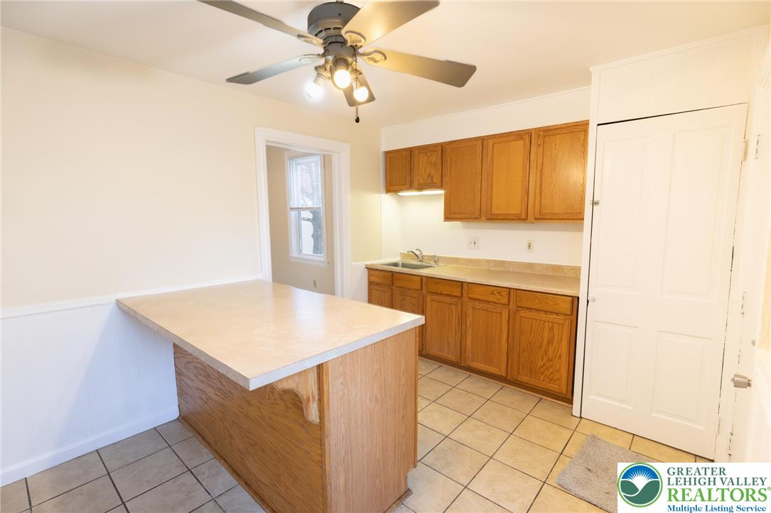 32 West Raspberry Street Bethlehem, PA 18018 - Photo 7 of 17 a kitchen with a stove a sink a refrigerator and cabinets