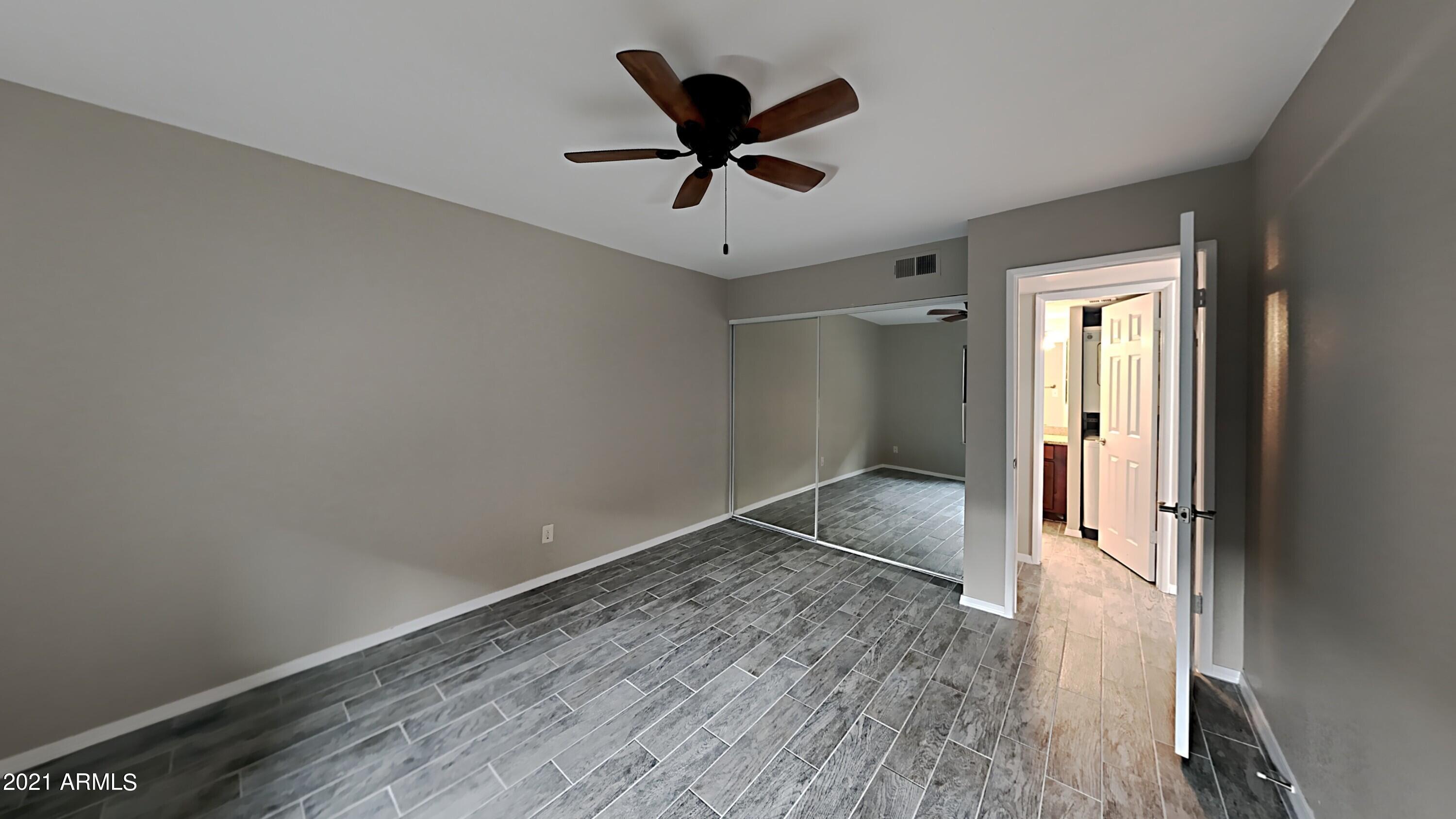 3500 North Hayden Road, Unit 1703 Scottsdale, AZ 85251 - Photo 5 of 8 a view of empty room with wooden floor