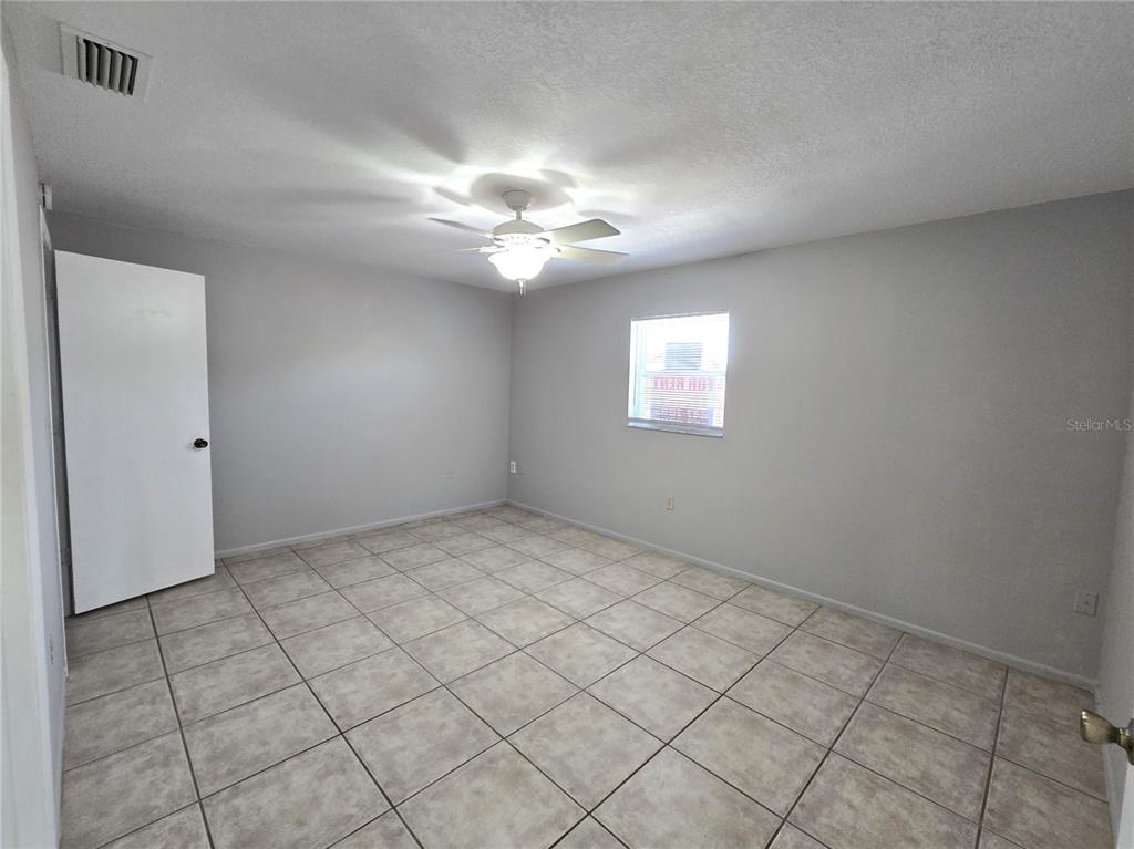 5422 Amy Lane New Port Richey, FL 34652 - Photo 13 of 25 a view of an empty room and window