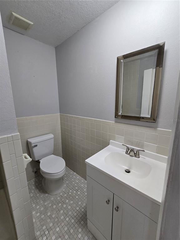 5422 Amy Lane New Port Richey, FL 34652 - Photo 17 of 25 a bathroom with a sink toilet and mirror