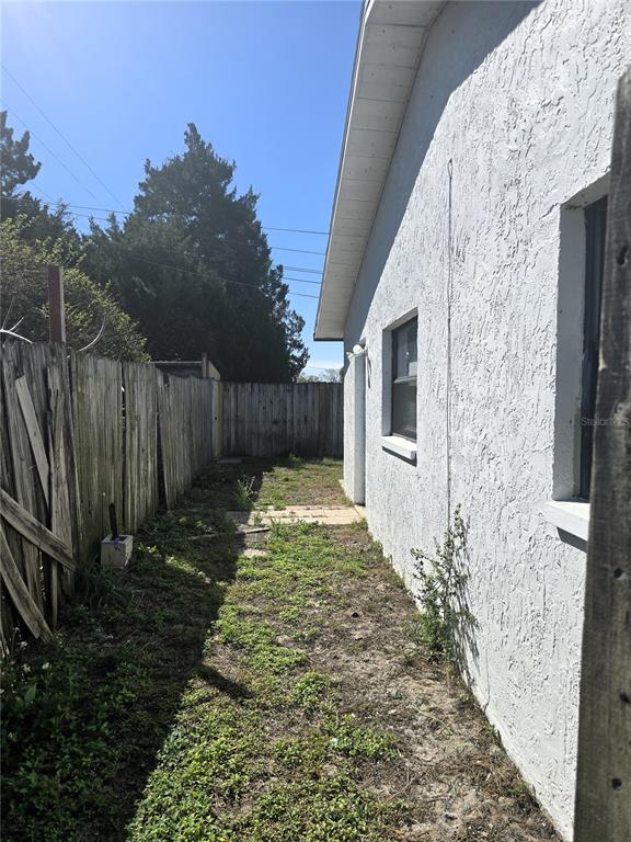 5422 Amy Lane New Port Richey, FL 34652 - Photo 25 of 25 a backyard of a house with lots of green space