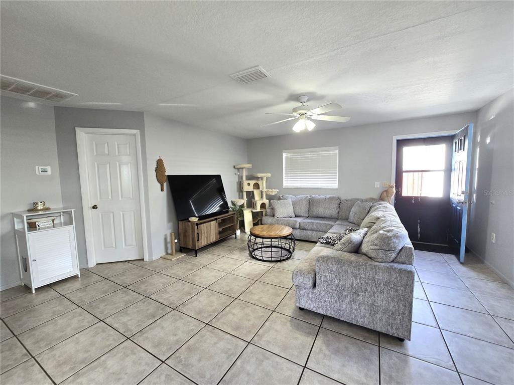 5422 Amy Lane New Port Richey, FL 34652 - Photo 6 of 25 a living room with furniture and a flat screen tv