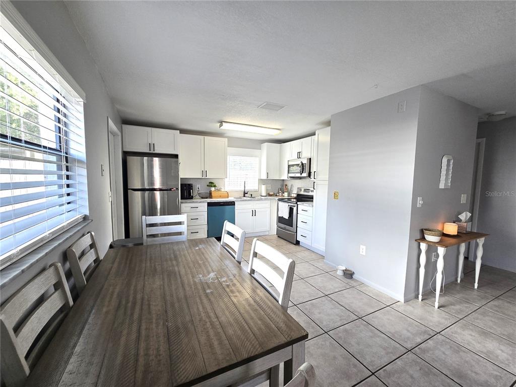 5422 Amy Lane New Port Richey, FL 34652 - Photo 7 of 25 a living room with furniture and kitchen view