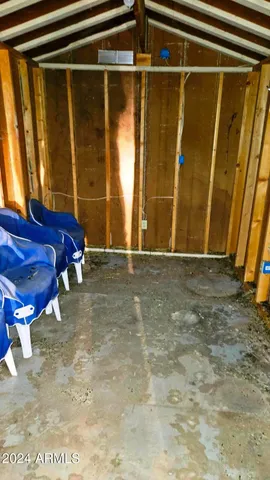 a view of walk in closet with clothes