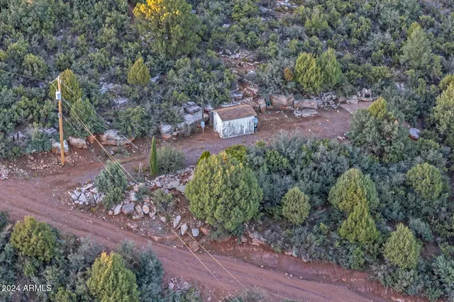 a backyard of a house with a yard and outdoor seating