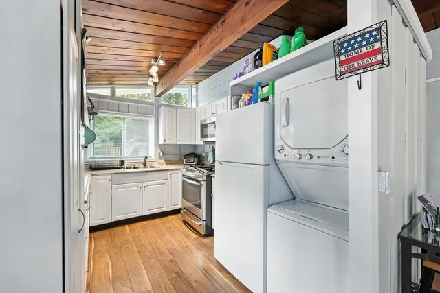 a white refrigerator freezer sitting inside of a kitchen