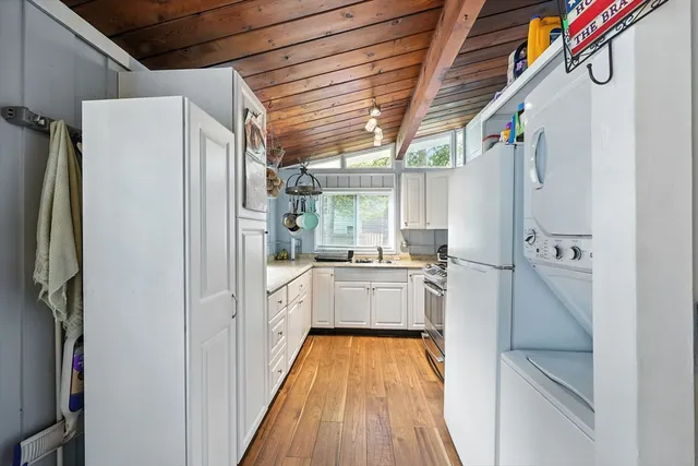 a kitchen with stainless steel appliances a refrigerator and a stove