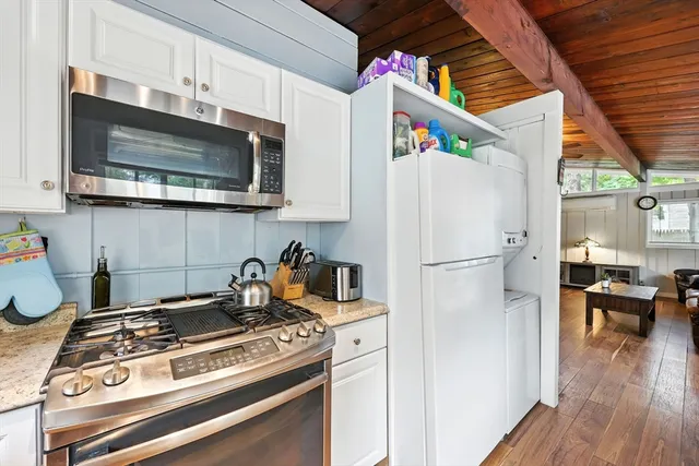 a kitchen with a stove and a microwave