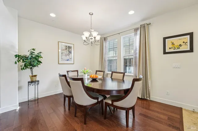 a living room with furniture fireplace and a large window