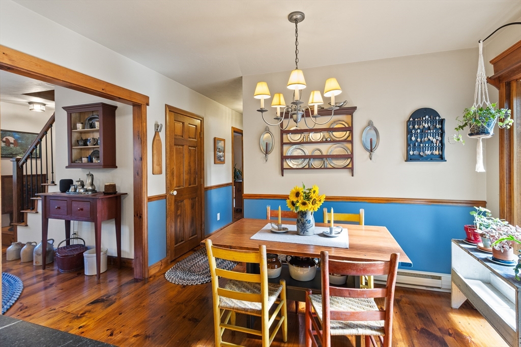 298 Torrey Road Southbridge, MA 01550 - Photo 11 of 40 a view of a dining room with furniture wooden floor and a chandelier