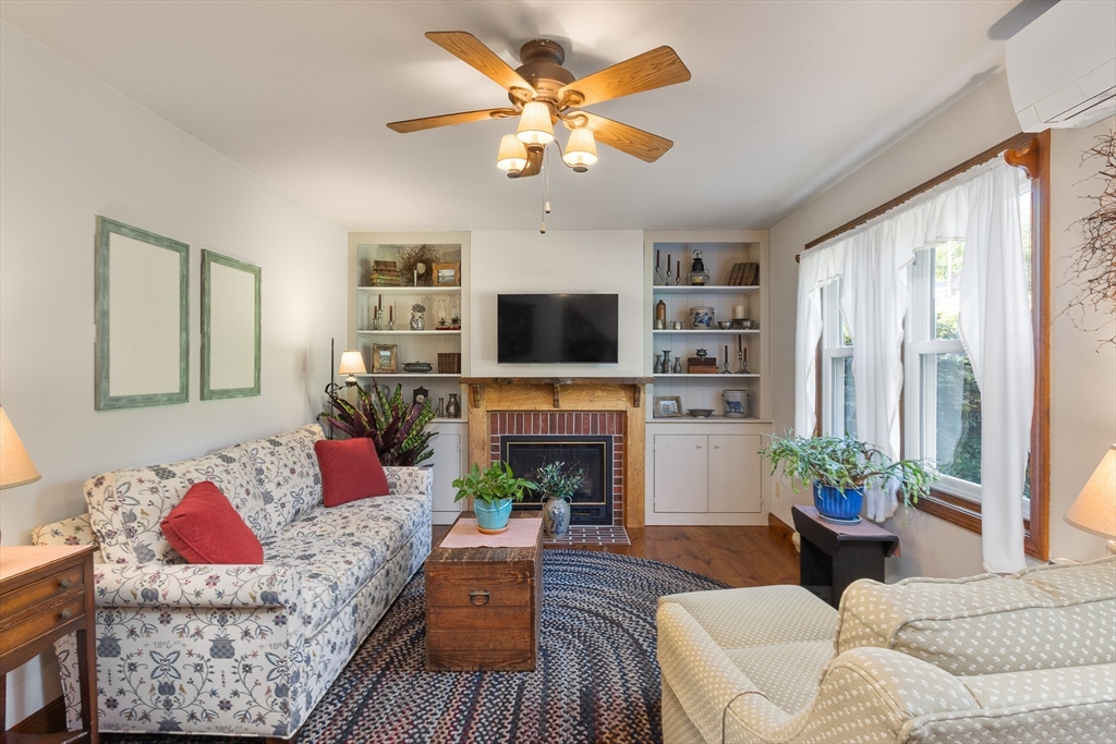 298 Torrey Road Southbridge, MA 01550 - Photo 14 of 40 a living room with furniture a fireplace and a flat screen tv