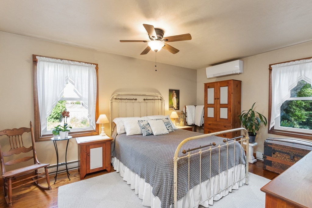 298 Torrey Road Southbridge, MA 01550 - Photo 19 of 40 a bedroom with a balcony a bed and a chandelier