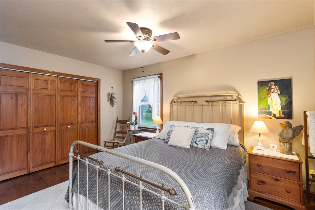 298 Torrey Road Southbridge, MA 01550 - Photo 20 of 40 a bedroom with a bed and wooden floor
