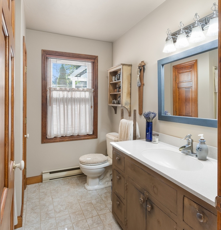 298 Torrey Road Southbridge, MA 01550 - Photo 21 of 40 a bathroom with a sink toilet a mirror and window
