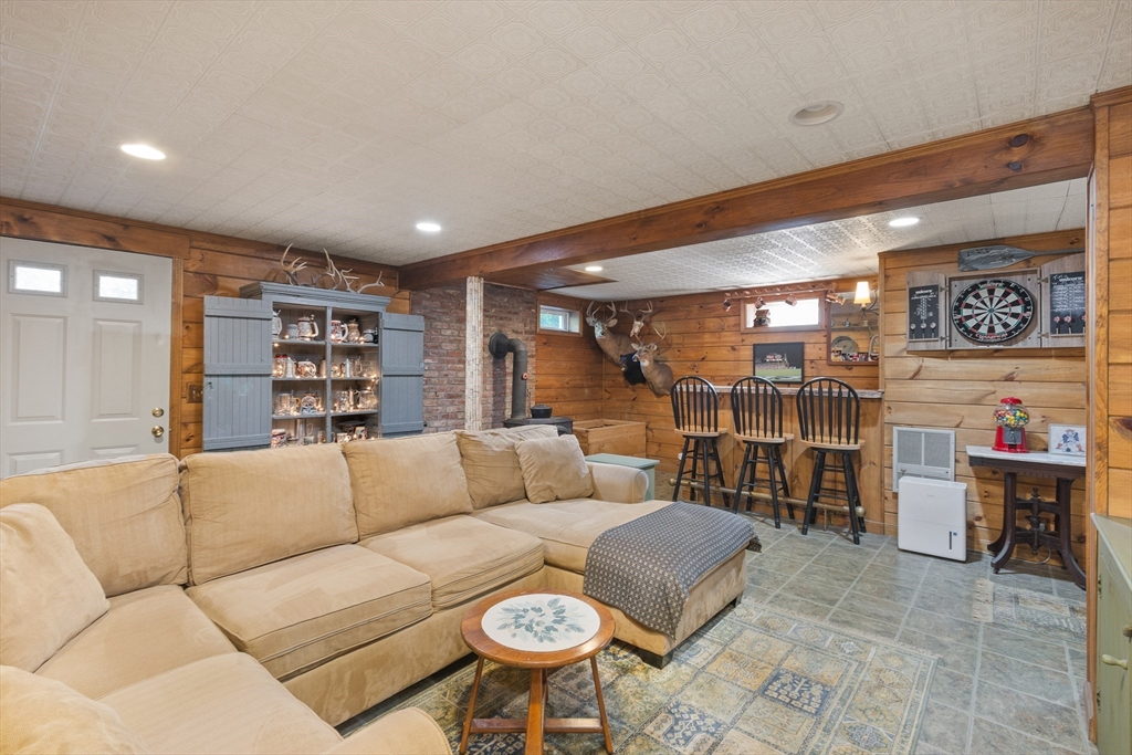 298 Torrey Road Southbridge, MA 01550 - Photo 22 of 40 a living room with furniture and a wall painting