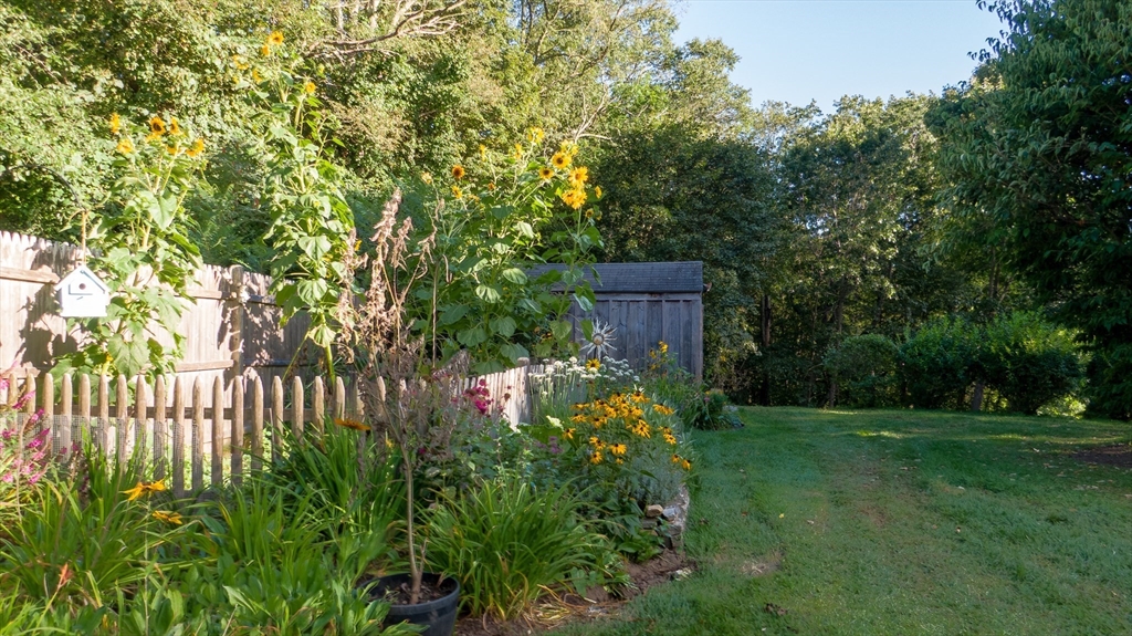 298 Torrey Road Southbridge, MA 01550 - Photo 29 of 40 a view of a backyard with brick wall and potted plants