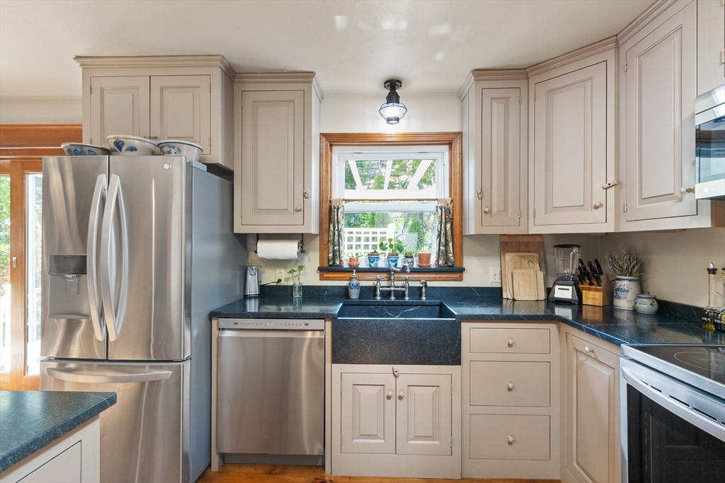 298 Torrey Road Southbridge, MA 01550 - Photo 4 of 40 a kitchen with granite countertop a refrigerator sink and cabinets