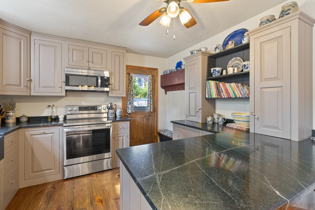 298 Torrey Road Southbridge, MA 01550 - Photo 6 of 40 a kitchen with stainless steel appliances granite countertop a stove and a sink