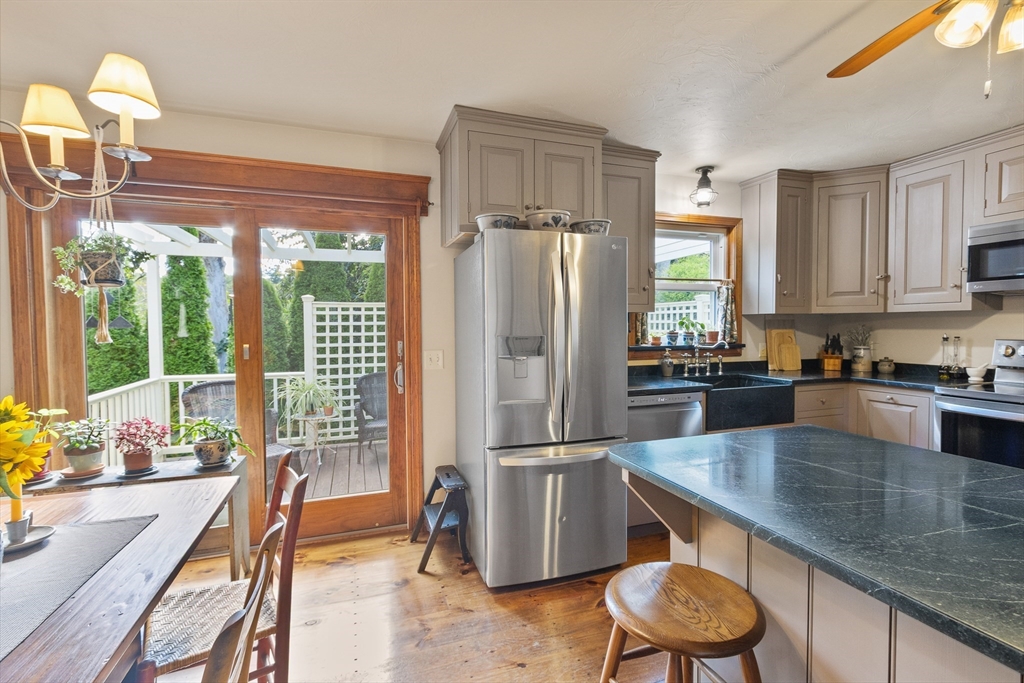 298 Torrey Road Southbridge, MA 01550 - Photo 9 of 40 a kitchen with refrigerator and window
