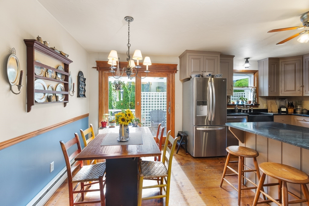 298 Torrey Road Southbridge, MA 01550 - Photo 10 of 40 a dining room filled chandelier and wooden floor