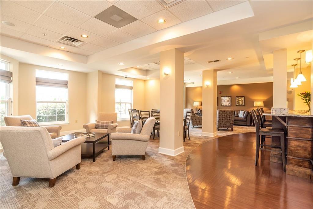 230 East Ponce De Leon Avenue, Unit 327 Decatur, GA 30030 - Photo 19 of 24 a living room with furniture and a table