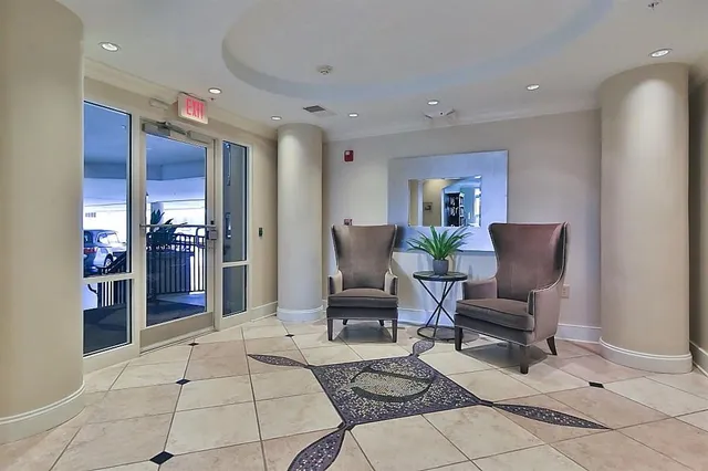 a living room with furniture and a rug