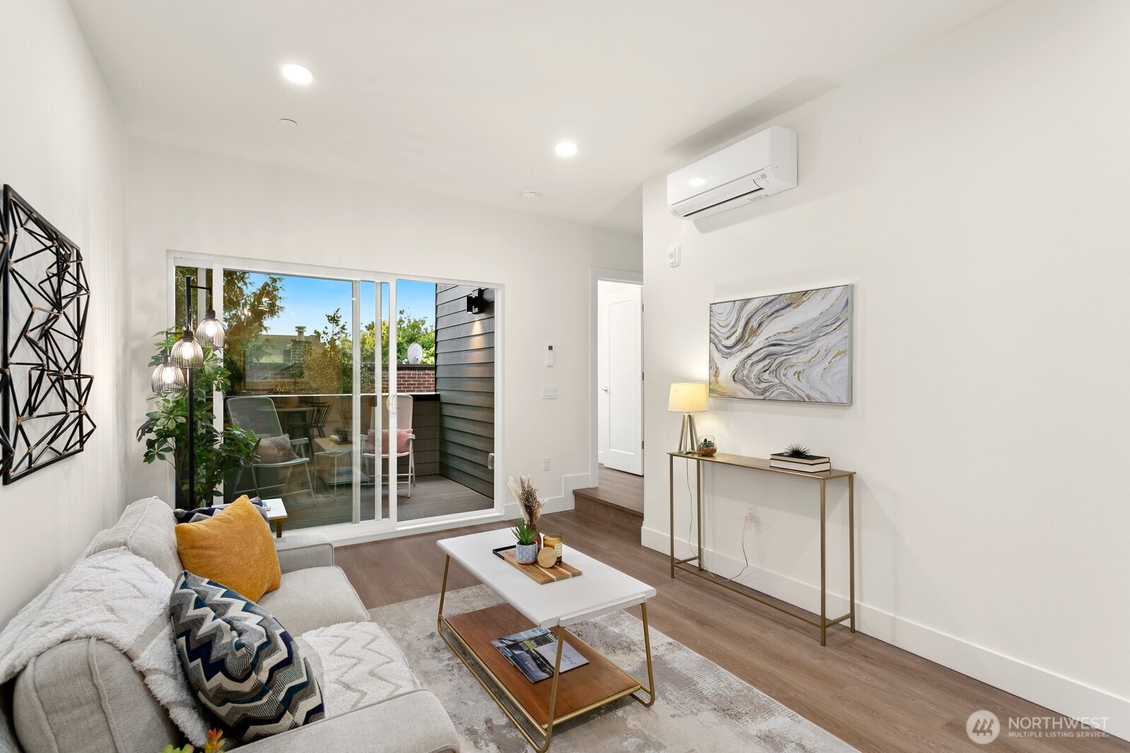 117 Wells Avenue South, Unit B Renton, WA 98057 - Photo 14 of 26 a living room with furniture and a floor to ceiling window