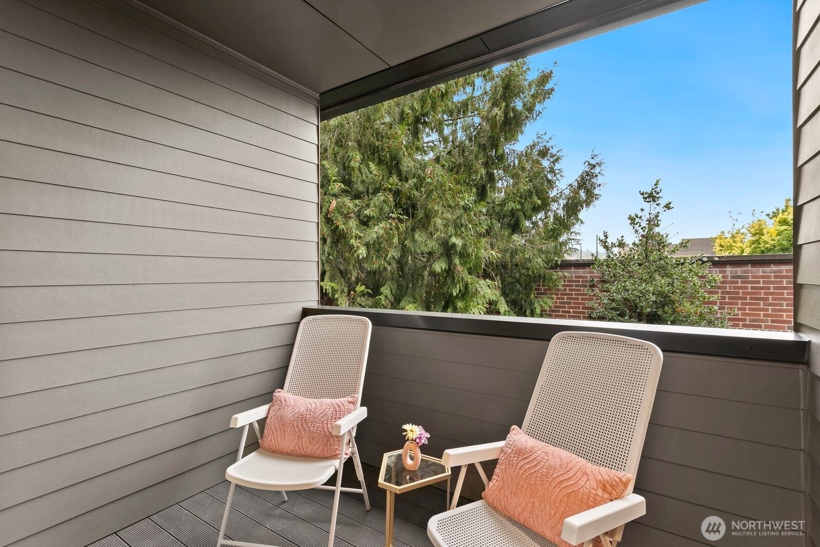 117 Wells Avenue South, Unit B Renton, WA 98057 - Photo 15 of 26 a view of a chair and table in wooden floor